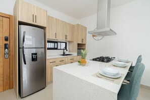 Fridge, microwave, stovetop, coffee/tea maker