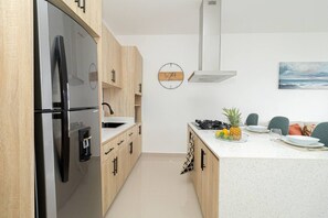 Fridge, microwave, stovetop, coffee/tea maker