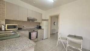 Fridge, oven, electric kettle, toaster