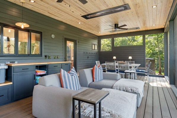 A modern kitchen with dark wood cabinets, a wooden countertop, and a built-in oven. - 3-bedroom, 2 bath urban-style lakefront bungalow on Sunset Cove in Abbeville, SC on Beautiful Lake Secession. (Abbeville)