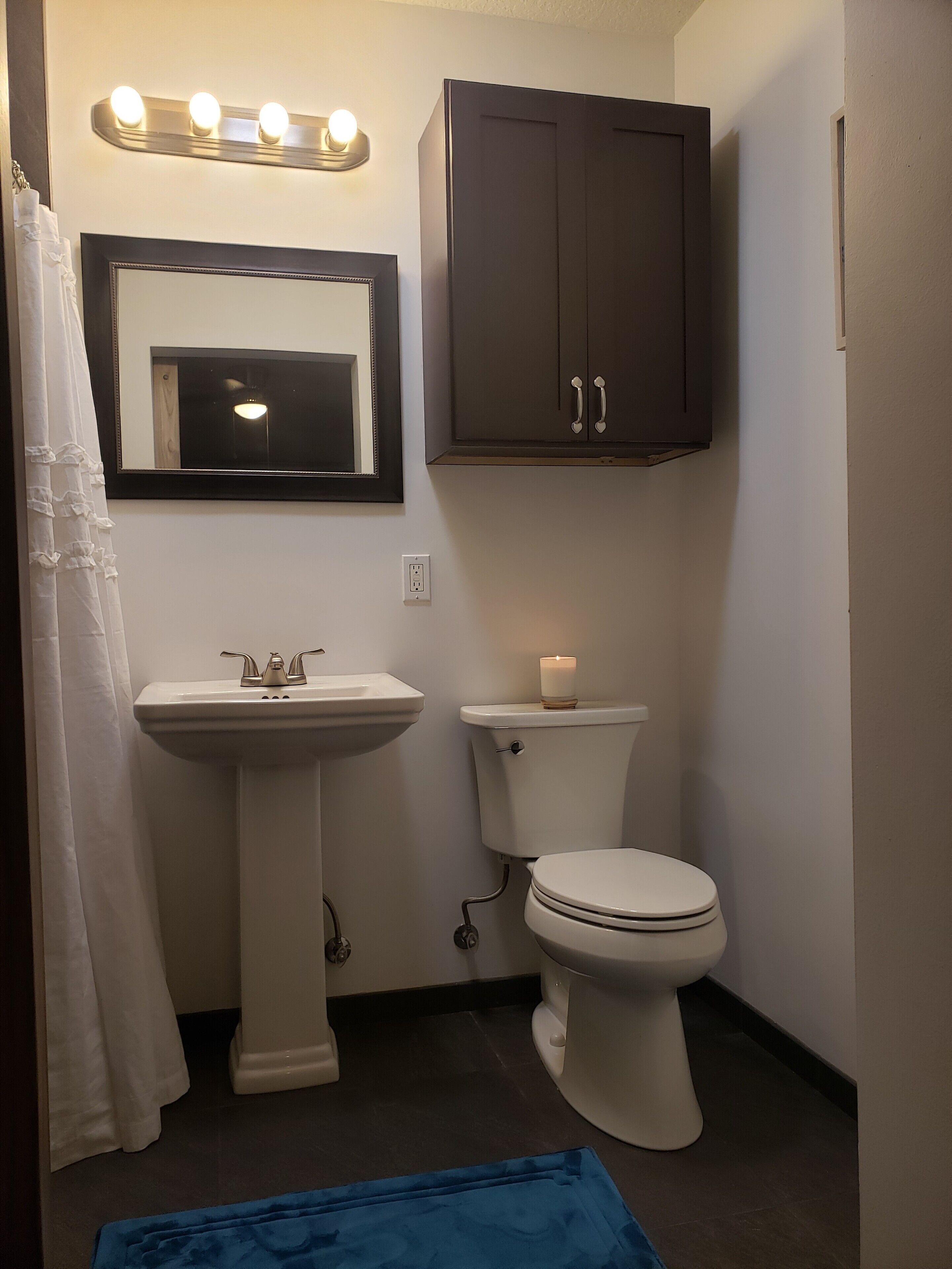 Shower, hair dryer, towels, toilet paper