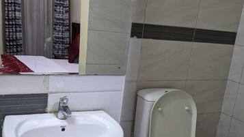 Shower, slippers, towels, soap