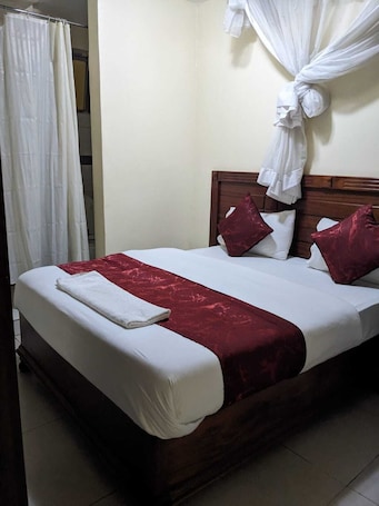 Deluxe Double Room, City View | Desk, laptop workspace, iron/ironing board, free WiFi