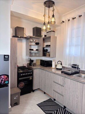 Apartamento Confort, vistas a la ciudad | Cocina privada