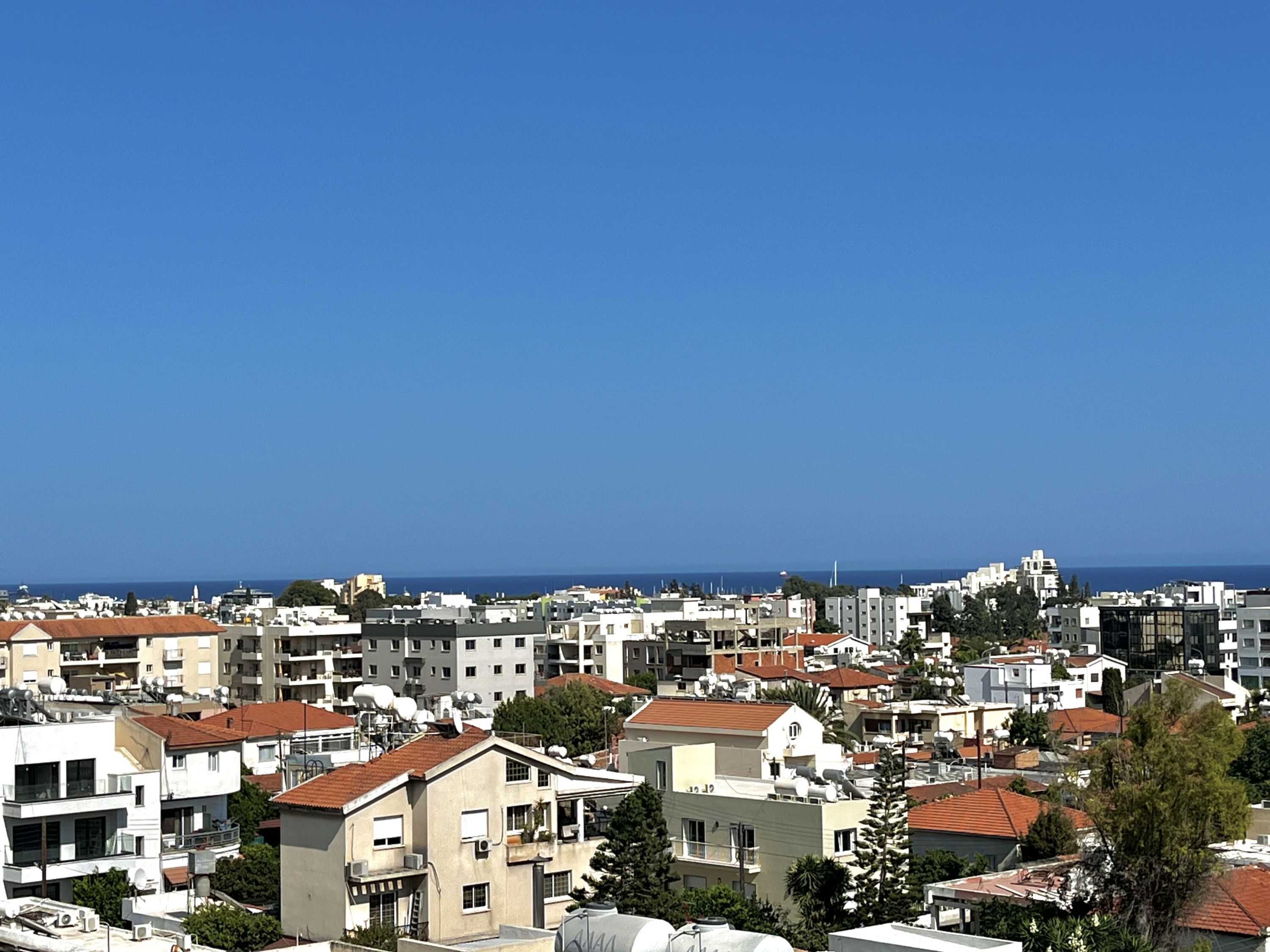 A densely packed urban area with various buildings, including residential and possibly commercial structures.