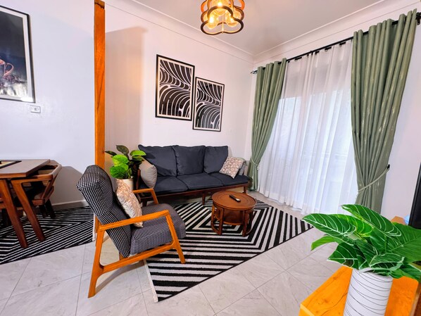 Departamento Confort, vista a la ciudad | Área de sala de estar