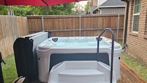 A hot tub on a wooden deck with a red canopy overhead. - Sporty Spot - Hot Tub - Walk to AT&T Stadium (Arlington)