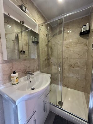 Shower, hair dryer, towels, soap