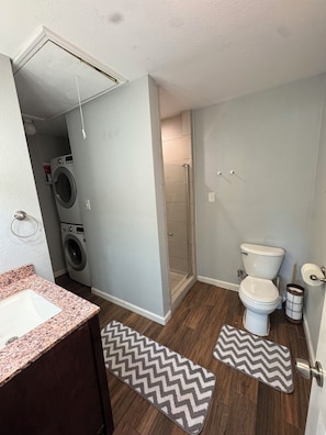 Shower, hair dryer, towels, soap