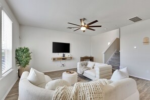 TV, fireplace - South Austin Luxe Boho House 4BR 2.5BA With SPA, Pool & EV Charger (Mustang Ridge)