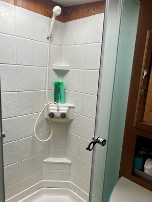 Shower, towels, soap, toilet paper
