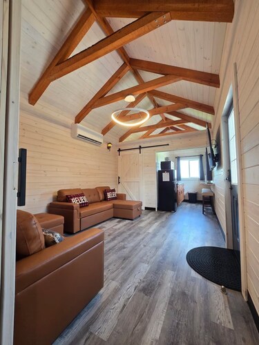 Enjoy cabin #64 at Heritage Acres Park with swimming, splash pad & more!