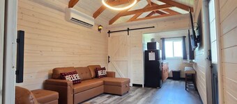 Enjoy cabin #64 at Heritage Acres Park with swimming, splash pad & more!