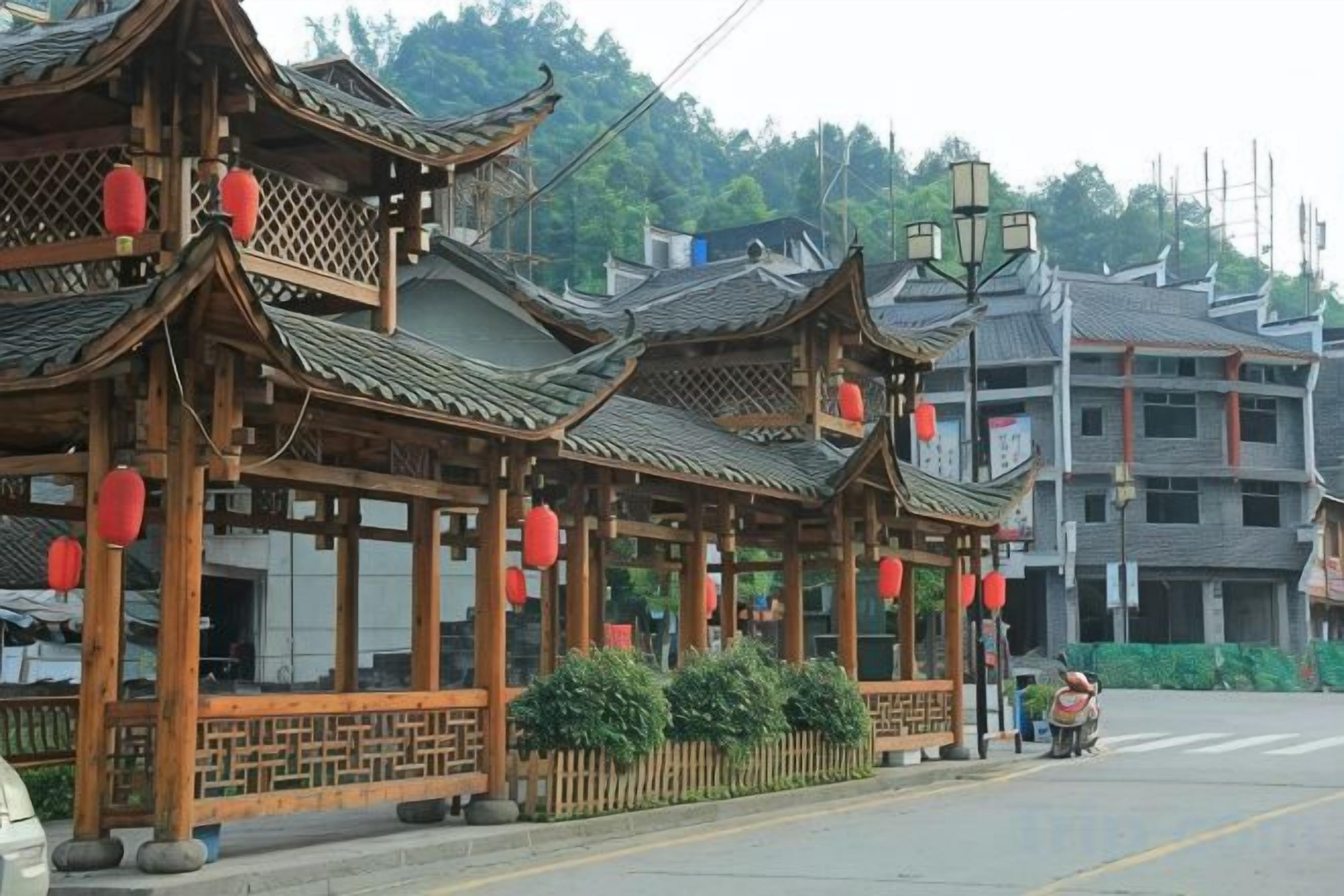Traditional Chinese architecture with multiple gabled roofs and red lanterns.