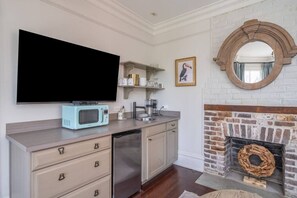 Fridge, microwave, coffee/tea maker, cookware/dishes/utensils