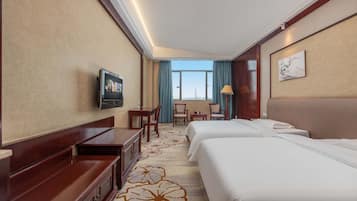 Luxury Twin Room, City View | Minibar, desk, laptop workspace, blackout drapes