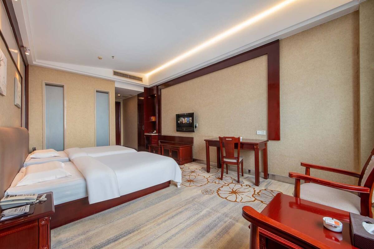 Luxury Twin Room, City View | Minibar, desk, laptop workspace, blackout drapes
