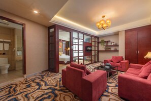 Luxury Suite, City View | Minibar, desk, laptop workspace, blackout curtains