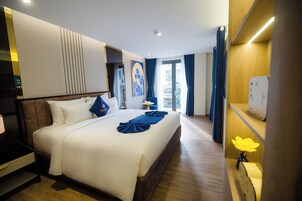 Executive Studio Suite | Premium bedding, minibar, in-room safe, blackout drapes