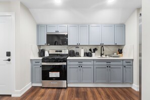 Fridge, microwave, oven, stovetop - Stylish 2BR Suite / Walk to Shops + Direct NYC Bus / Parking Included (North Bergen)