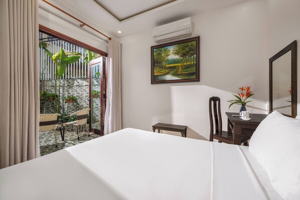 Family Room, Garden View | Premium bedding, minibar, desk, laptop workspace