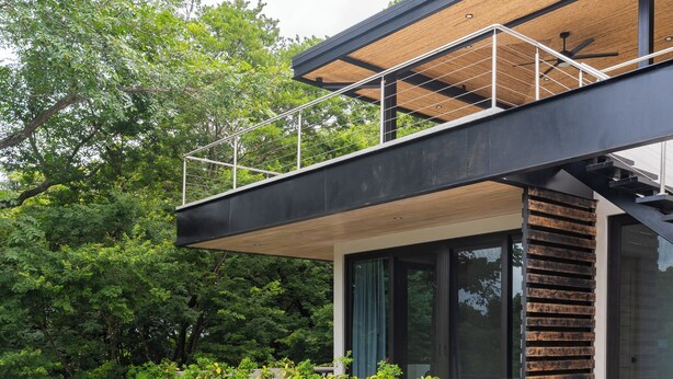 A modern two-story house with a rooftop terrace, a swimming pool, and lush greenery. - Casa Pipeline: Jungle Villa, Pool, Sleeps 14 (Nosara)