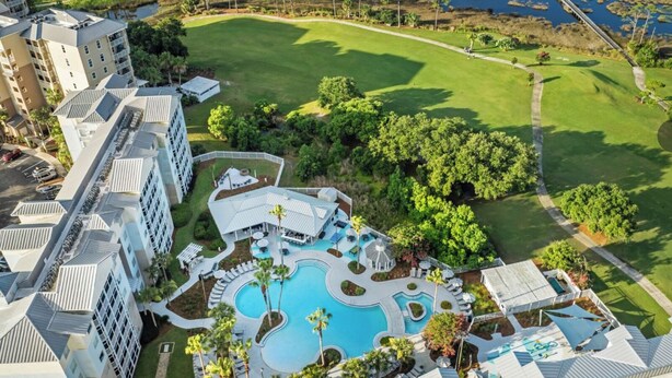 A hotel with a pool area, a golf course, and a marina.