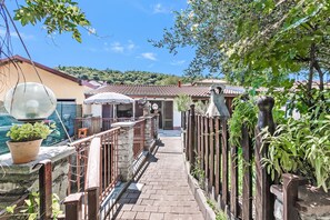 Apartamento familiar, 1 habitación, microondas (Casa Rolè, Lake Maggiore Patio House) | Jardines del alojamiento