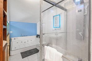 Shower, jetted tub, hair dryer, towels