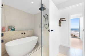 Shower, hair dryer, towels, shampoo