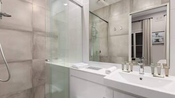 Shower, hair dryer, towels, shampoo