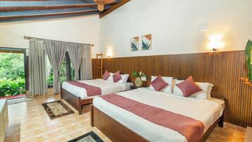 Family Quadruple Room, Multiple Beds, Air conditioning, Garden View | Iron/ironing board, bed sheets