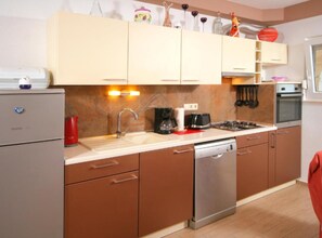 Apartment (Two Bedroom Apartment with Balcony) | Private kitchen | Fridge