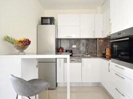 Apartment (Three Bedroom Apartment with Balcony) | Private kitchen | Fridge, cookware/dishes/utensils