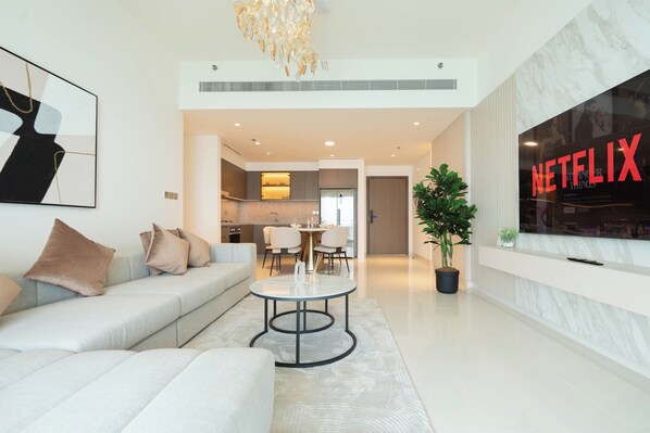 Deluxe Apartment, Sea View | Living area | 125-cm flat-screen TV with digital channels, Netflix, streaming services