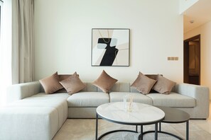 Deluxe appartement, uitzicht op zee | Woonruimte