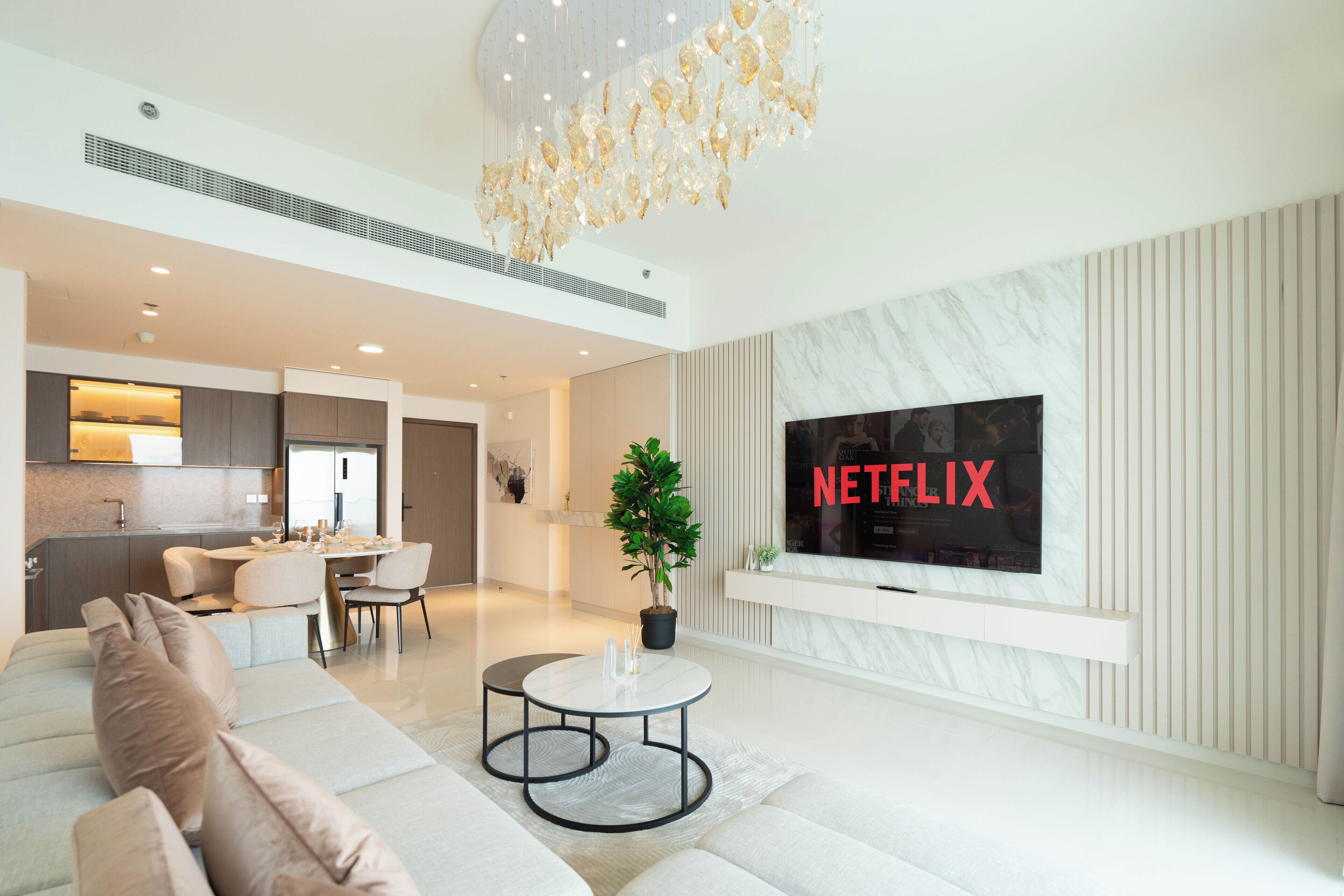 Deluxe Apartment, Sea View | Living area | 125-cm flat-screen TV with digital channels, Netflix, streaming services