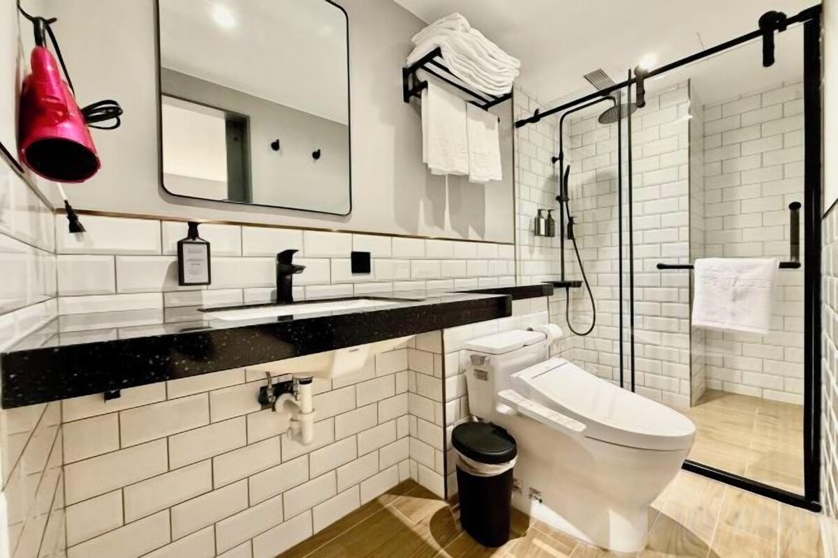 Bathroom | Shower, hair dryer, slippers, towels