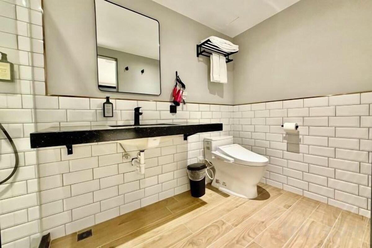 Bathroom | Shower, hair dryer, slippers, towels