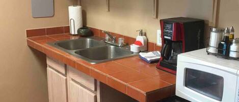Microwave, coffee/tea maker, toaster, cookware/dishes/utensils