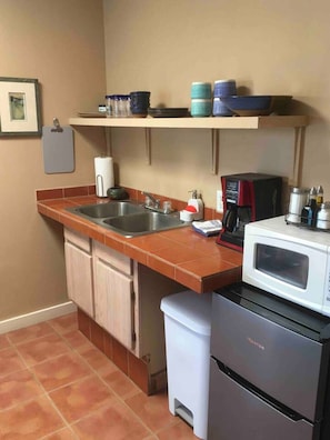 Microwave, coffee/tea maker, toaster, cookware/dishes/utensils