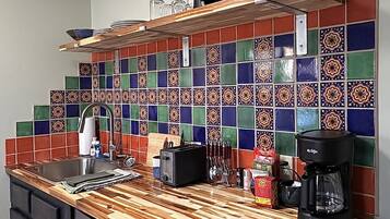 Microwave, coffee/tea maker, toaster, cookware/dishes/utensils