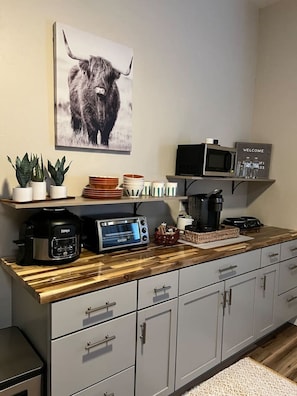 Microwave, coffee/tea maker, toaster, cookware/dishes/utensils