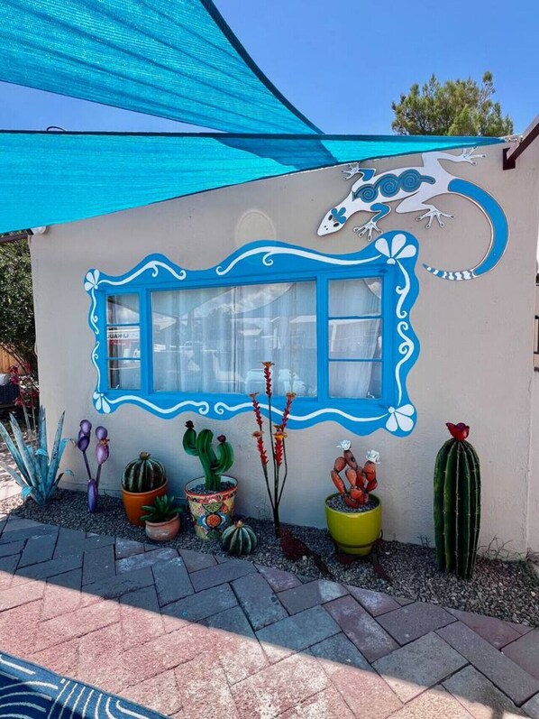 A building with a blue window frame and a mural of a sea creature. - Mid-century marvelous 1 bed, pets welcome! (Las Cruces)