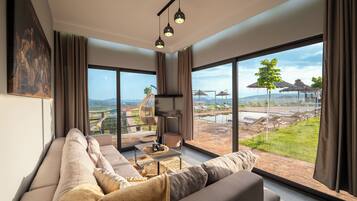 Deluxe Apartment, Balcony, Courtyard View | Living area | Flat-screen TV