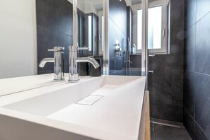 Shower, eco-friendly toiletries, hair dryer, towels