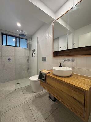 Shower, towels, soap, toilet paper