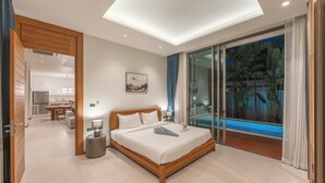 A modern bedroom with a large bed, a glass door leading to a balcony, and a view of tropical plants. - Pool Villa Near Beach Boat Avenue V219 (Choeng Thale)