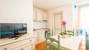 Apartment, 1 Bedroom, Balcony | Dining room - Charming Baia Marina Apartment (Orosei)