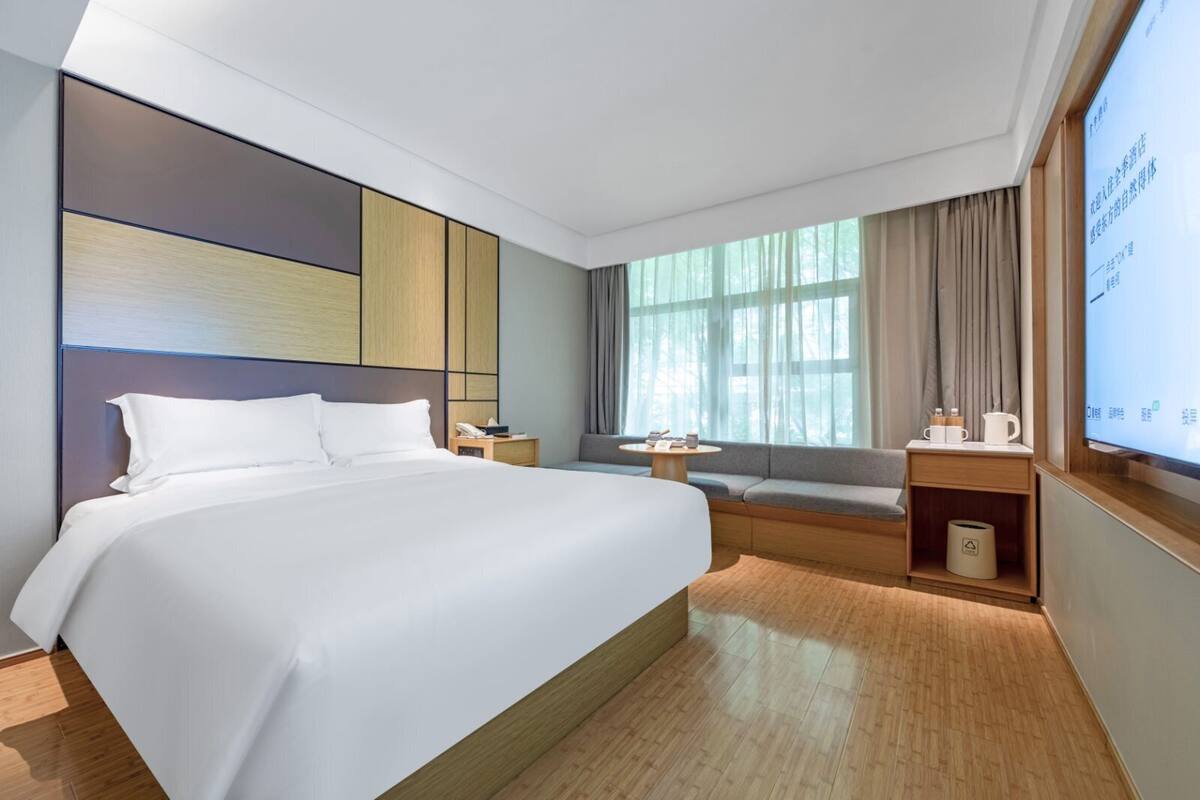 Habitación Business | Tabla de planchar con plancha, wifi gratis, ropa de cama